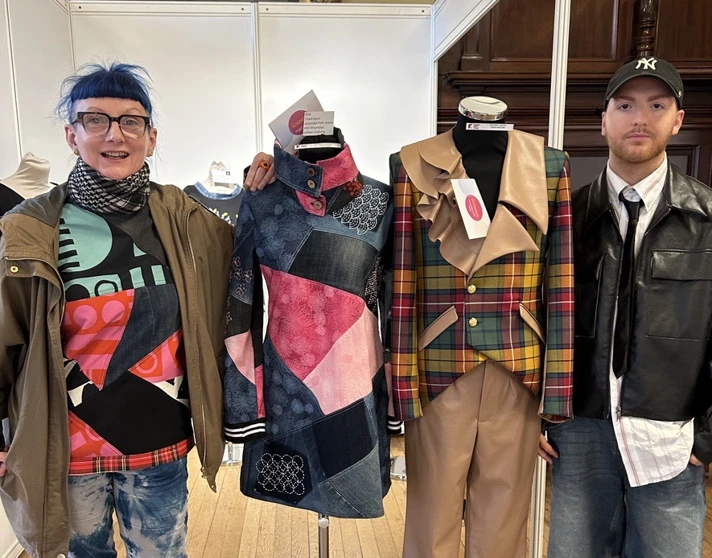 Glasgow Kelvin students Evy Craig and Craig Watson standing proudly beside their award-winning fashion designs at Craftex 2025. Glasgow Kelvin students Evy Craig and Craig Watson standing proudly beside their award-winning fashion designs at Craftex 2025.